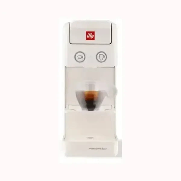 Macchina da caffè Illy bianca compatta con tazze e pulsanti per espresso e cappuccino