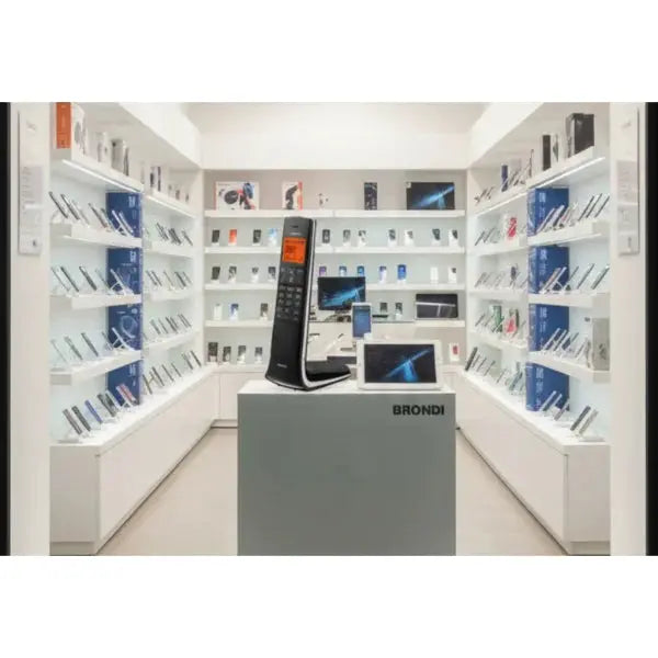 Telefono Cordless Brondi esposto in una vetrina moderna con altri dispositivi tecnologici