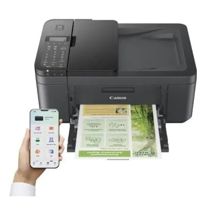 Stampante Canon multifunzione nera wireless con scanner e stampa a colori da smartphone in uso